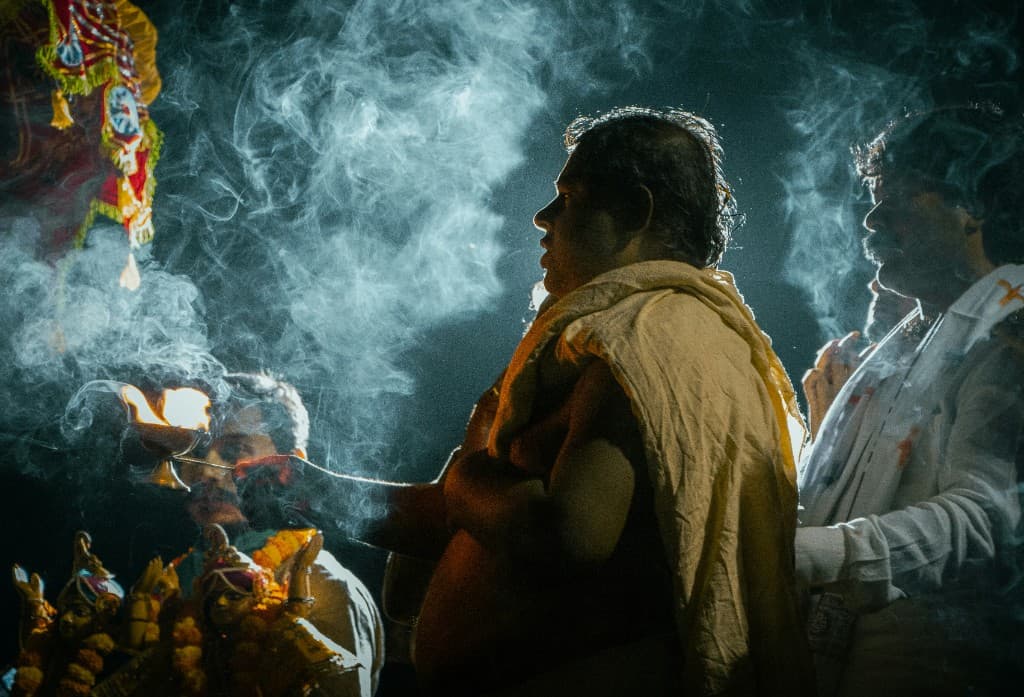 Hindu pandit performing a traditional puja ceremony